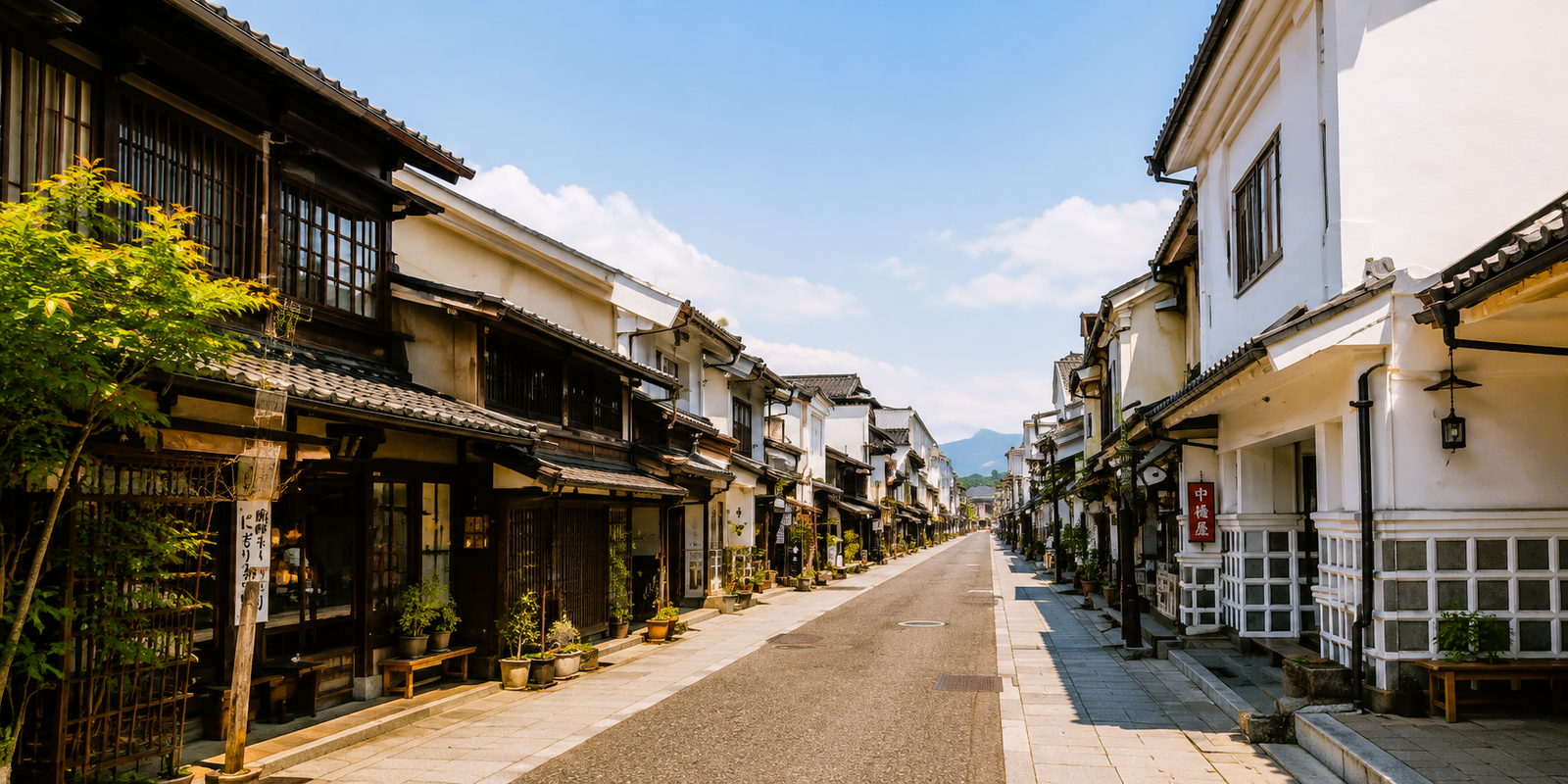 Namako-kabe black-and-white storehouse walls lining Nakamachi Street in Matsumoto